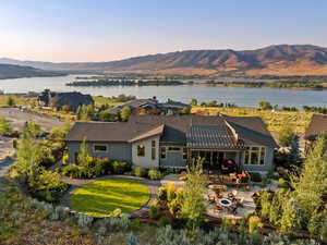 Exterior space with a water and mountain view