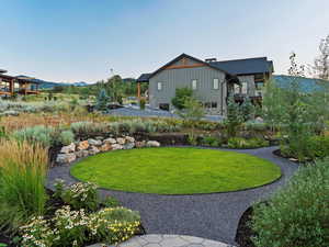 View of yard featuring a mountain view and a balcony