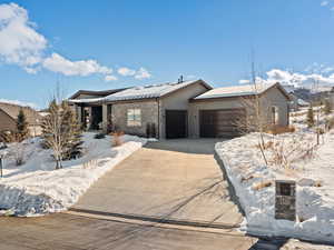 View of front of property featuring a garage