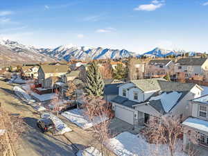 Snowy aerial view with a mountain view