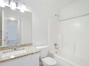 Full bathroom with vanity, toilet, and bathing tub / shower combination