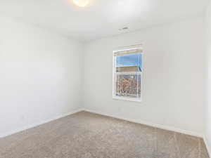 Empty room featuring carpet floors