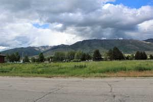 View of mountain feature with a rural view