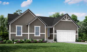 View of front of house featuring a front yard and a garage