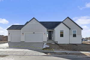 View of front facade featuring a garage