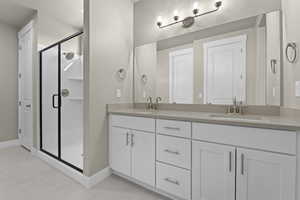 Bathroom with vanity and an enclosed shower