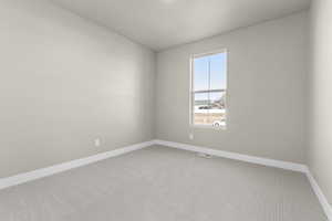 Unfurnished room featuring carpet flooring