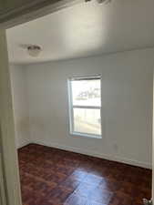 Unfurnished room featuring a textured ceiling