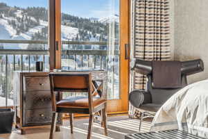 Living area with a mountain view and carpet