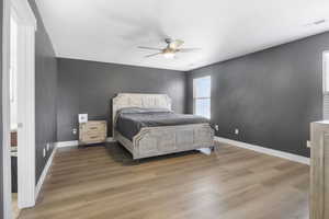 Bedroom with light wood-type flooring and ceiling fan