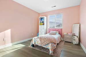 Bedroom featuring hardwood / wood-style flooring