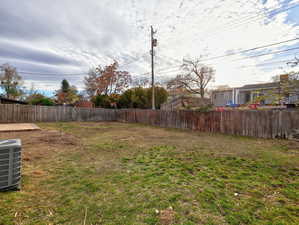 View of yard with central AC unit