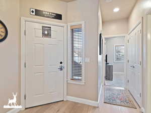 Foyer entrance featuring light hardwood / wood-style flooring