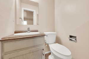 Bathroom featuring vanity and toilet