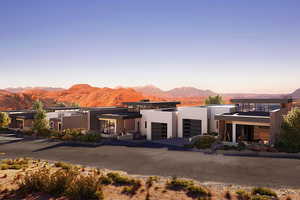 View of front of house with a mountain view and a garage