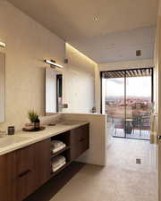 Bathroom with tile patterned floors, vanity, and a bath