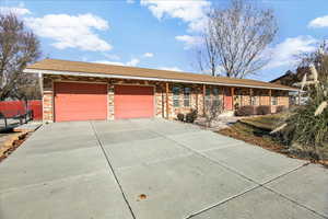 Ranch-style house featuring a garage