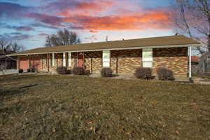 View of front of home featuring a yard