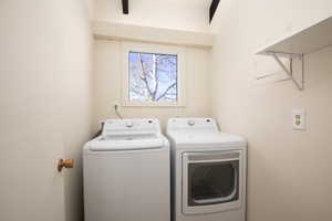 Clothes washing area with washer and clothes dryer