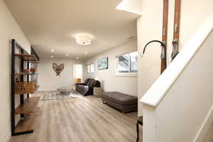 Living area featuring light hardwood / wood-style floors