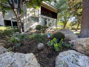 View of yard with a balcony