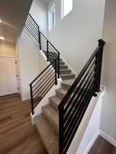 Stairs with hardwood / wood-style flooring