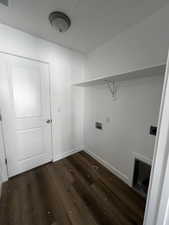 Washroom with washer hookup and dark hardwood / wood-style flooring