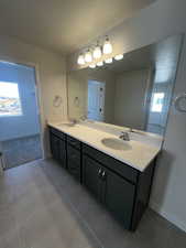 Bathroom with vanity and a healthy amount of sunlight