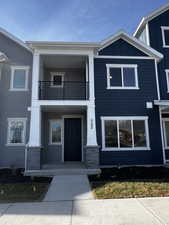 View of front of house with a balcony