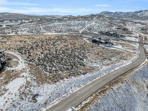 Snowy aerial view featuring a mountain view