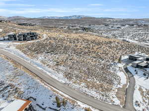 Snowy aerial view with a mountain view