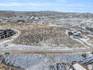 Snowy aerial view featuring a mountain view