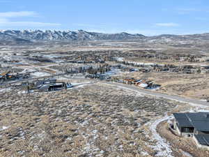 Snowy aerial view with a mountain view