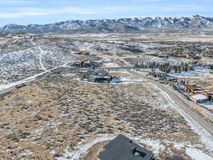 Snowy aerial view featuring a mountain view