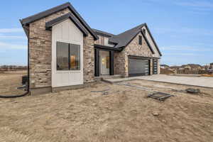 View of front facade featuring a garage