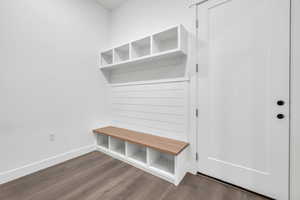 Mudroom with hardwood / wood-style flooring