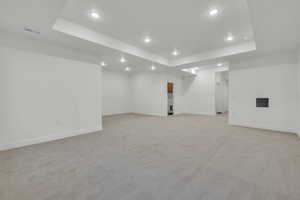 Basement with light carpet