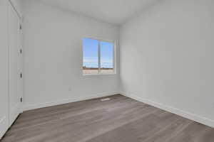 Spare room featuring light wood-type flooring