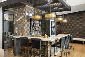 Bar featuring wood-type flooring