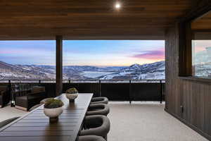 Interior space with a mountain view and wood ceiling