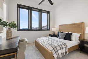 Bedroom featuring light carpet and ceiling fan