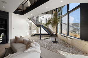 Living room featuring a mountain view and carpet