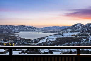 Property view of mountains with a water view