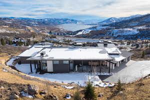 Exterior space featuring a mountain view and an outdoor structure