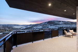 Exterior space featuring a mountain view and a balcony