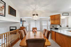 Dining space featuring a wealth of natural light and an inviting chandelier