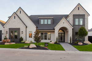 View of front of property featuring a front yard