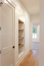 Corridor featuring light hardwood / wood-style flooring