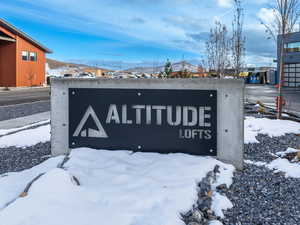 Community sign featuring a mountain view