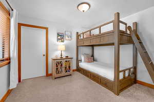 Bedroom with light colored carpet